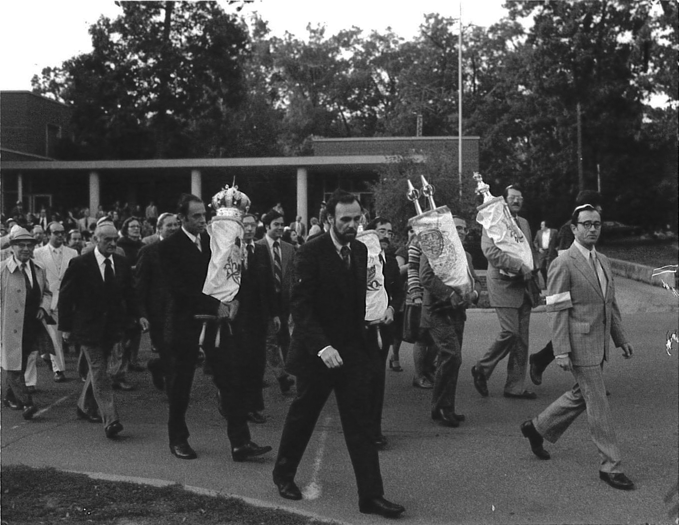 Marching the Torahs from the 1429 Hill building to the new synagogue at 2000 Washtenaw. Rabbi Alan Kensky on the left, Henry Gershowitz on the right. Erev Rosh HaShanah 1978.